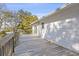Spacious deck overlooking mature trees with wood railings and lots of space for entertaining at 2005 Havens Dr., North Myrtle Beach, SC 29582