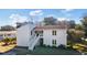 Charming two-story home with white siding and inviting stairs to a second level porch at 2005 Havens Dr., North Myrtle Beach, SC 29582