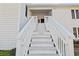 Front entrance view of a home with exterior stairs leading to an entrance door at 2005 Havens Dr., North Myrtle Beach, SC 29582