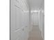Hallway with neutral carpet and white doors along a wall at 2005 Havens Dr., North Myrtle Beach, SC 29582