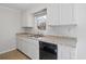 The kitchen is equipped with white cabinets, granite countertops, and modern appliances at 2005 Havens Dr., North Myrtle Beach, SC 29582