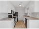 The kitchen is equipped with white cabinets, granite countertops, and modern black appliances at 2005 Havens Dr., North Myrtle Beach, SC 29582