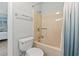 Bathroom featuring toilet, shower-tub combo with glass door, and coastal-inspired paint at 207 Double Eagle Dr. # F-3, Myrtle Beach, SC 29575