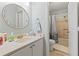 Bathroom featuring a round mirror, vanity, and shower-tub combo with patterned curtain at 207 Double Eagle Dr. # F-3, Myrtle Beach, SC 29575
