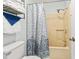 Bathroom featuring a blue patterned curtain, stainless shower head, and towel rack at 207 Double Eagle Dr. # F-3, Myrtle Beach, SC 29575