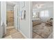 Bright, airy bedroom with bath access, neutral paint, wood-look floors, and coastal-inspired décor at 207 Double Eagle Dr. # F-3, Myrtle Beach, SC 29575