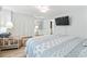 Bedroom boasts an inviting color palette, wood-look flooring, and closet and bath access at 207 Double Eagle Dr. # F-3, Myrtle Beach, SC 29575