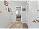 Hallway features wood-look floors, closet space, and coastal décor leading to a bedroom space at 207 Double Eagle Dr. # F-3, Myrtle Beach, SC 29575