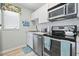 Updated kitchen featuring stainless steel appliances and modern white cabinets at 207 Double Eagle Dr. # F-3, Myrtle Beach, SC 29575