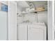 Functional laundry room with a washer, dryer, and shelves, providing convenience at 207 Double Eagle Dr. # F-3, Myrtle Beach, SC 29575