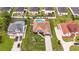 Aerial view of a well-maintained home with lush landscaping, a private driveway, and a fenced backyard with a pool at 2191 Deerfield Ave., Surfside Beach, SC 29575