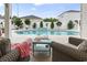 Outdoor patio showcasing comfortable seating and a refreshing pool with a decorative waterfall feature at 2191 Deerfield Ave., Surfside Beach, SC 29575