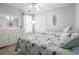 Charming bedroom featuring two beds, coastal-themed decor, tiled floors, a large window and a white dresser at 2191 Deerfield Ave., Surfside Beach, SC 29575
