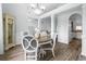 Inviting dining area showcasing wood floors, decorative columns, and an open layout to the living space at 2191 Deerfield Ave., Surfside Beach, SC 29575