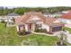 Charming single-Gathering home featuring manicured landscaping, a brick facade, and a welcoming red front door at 2191 Deerfield Ave., Surfside Beach, SC 29575
