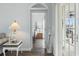 Hallway view into bedroom, showcasing stylish lamp and nautical decor at 2191 Deerfield Ave., Surfside Beach, SC 29575