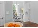 View of dining room from kitchen area with white cabinets and stainless steel appliances at 2191 Deerfield Ave., Surfside Beach, SC 29575
