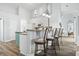 Bright kitchen features bar seating, stainless appliances and wooden floors at 2191 Deerfield Ave., Surfside Beach, SC 29575