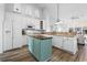 Well-equipped kitchen featuring white cabinets, a center island, and modern appliances at 2191 Deerfield Ave., Surfside Beach, SC 29575