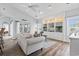 Inviting living room with built-in shelving, ceiling fan, and sliding glass door to patio at 2191 Deerfield Ave., Surfside Beach, SC 29575