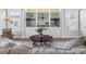 Cozy living room featuring a large window and built-in shelving with nautical decor at 2191 Deerfield Ave., Surfside Beach, SC 29575