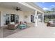 Relaxing covered patio featuring comfortable seating and ceiling fans, ideal for enjoying the outdoors at 2191 Deerfield Ave., Surfside Beach, SC 29575