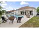 Beautiful backyard pool and patio area with comfortable seating, perfect for relaxation and outdoor entertaining at 2191 Deerfield Ave., Surfside Beach, SC 29575
