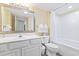 Bathroom with a single sink vanity and shower/tub combo with fresh towels at 2201 South Ocean Blvd. # 1808, Myrtle Beach, SC 29577