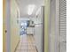 Hallway leading to living areas with kitchen view, offering convenience and functionality at 2201 South Ocean Blvd. # 1808, Myrtle Beach, SC 29577