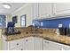 Close-up of well-equipped kitchen featuring granite counters, dishwasher and sink at 2201 South Ocean Blvd. # 1808, Myrtle Beach, SC 29577