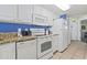 Bright kitchen features white appliances and plenty of counter space for meal preparation at 2201 South Ocean Blvd. # 1808, Myrtle Beach, SC 29577