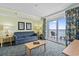 Comfortable living room featuring a sofa, coffee table and balcony access with ocean views at 2201 South Ocean Blvd. # 1808, Myrtle Beach, SC 29577