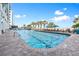 Inviting outdoor pool with blue water, lounge chairs, umbrellas, and palm trees for a relaxing getaway at 2201 South Ocean Blvd. # 1808, Myrtle Beach, SC 29577