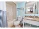 Well-lit bathroom with a shower-tub combo, toilet, and vanity with granite-style countertop and mirror at 2311 South Ocean Blvd. # 559, Myrtle Beach, SC 29577