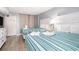 Comfortable bedroom featuring two beds with striped bedding, a dresser, and access to the exterior at 2311 South Ocean Blvd. # 559, Myrtle Beach, SC 29577