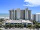 Beautiful exterior featuring palm trees, beach access and a parking garage at 2311 South Ocean Blvd. # 559, Myrtle Beach, SC 29577