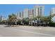 Attractive exterior of a multi-story resort with manicured landscaping and shade trees at 2311 South Ocean Blvd. # 559, Myrtle Beach, SC 29577