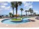 Beautiful outdoor lazy river with tropical palm trees, inviting lounge chairs, and clear blue water at 2311 South Ocean Blvd. # 559, Myrtle Beach, SC 29577