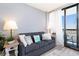 Cozy living room with sofa and a sliding door to the balcony with a view at 2311 South Ocean Blvd. # 559, Myrtle Beach, SC 29577