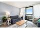 Cozy living room with sofa, coffee table, and view of the balcony at 2311 South Ocean Blvd. # 559, Myrtle Beach, SC 29577