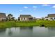 Landscaped backyard with a pond and view from the back of the home at 2317 Myerlee Dr., Myrtle Beach, SC 29588