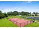 Community basketball court with red surface, backboards, and nets in fenced area at 2317 Myerlee Dr., Myrtle Beach, SC 29588