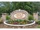 Elegant entrance sign to Cameron Village, a Beazer Homes community, with stone accents and landscaped flower bed at 2317 Myerlee Dr., Myrtle Beach, SC 29588