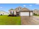 Charming home with a well-manicured lawn, professional landscaping, and attached garage at 2317 Myerlee Dr., Myrtle Beach, SC 29588