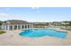 Aerial view of large community pool with clubhouse, kiddie pool, and playground at 2317 Myerlee Dr., Myrtle Beach, SC 29588