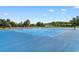 Community tennis courts with blue surface and nets under a blue sky at 2317 Myerlee Dr., Myrtle Beach, SC 29588