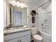 Full bathroom featuring granite countertop, a large mirror, and a shower over tub at 240 Wagner Cir., Conway, SC 29526