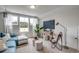 Cozy living room with a large window, TV, chair, and stools creates a relaxing ambiance at 240 Wagner Cir., Conway, SC 29526
