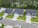 Aerial view of home in new neighborhood with manicured lawns, matching houses, and tree-lined streets at 2405 Capri Court, Conway, SC 29527