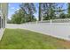 Well maintained backyard featuring vibrant green lawn and pristine white lattice fence at 2405 Capri Court, Conway, SC 29527